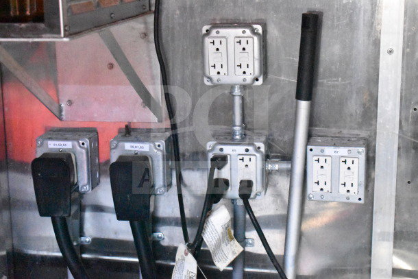 Electrical outlets and wiring inside Titanium Cargo Trailer, indicating power setup for Wendy's food equipment.