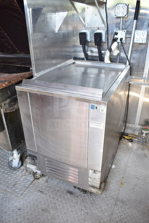 Titanium Cargo Trailers 8.5'x28' food trailer featuring stainless steel refrigerated unit, electrical outlets, and storage space.