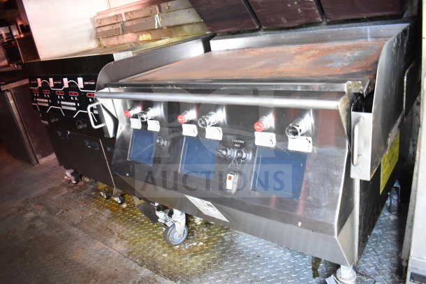 Titanium Cargo Trailers 8.5'x28' food trailer with CaptiveAire grease hood, Taylor shake machine, Henny Penny fryer, refrigeration.
