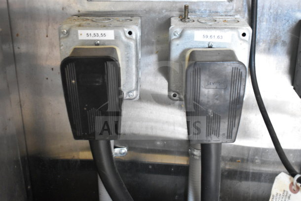 Power outlets in Titanium Cargo Trailer with Leviton plugs, labeled for circuits 51, 53, 55 and 59, 61, 63.