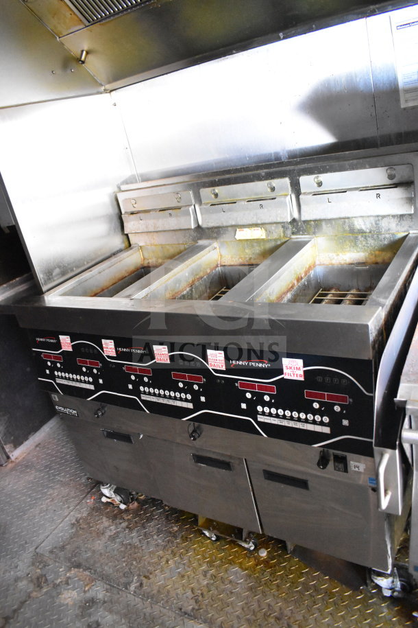 Titanium Cargo Trailers 8.5'x28' Wendy's food trailer interior with Henny Penny fryer, visible grease hood, used condition.