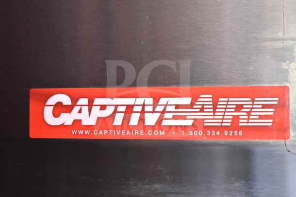 "CaptiveAire label on a Titanium Cargo Trailers food trailer, detailing ventilation equipment, with website and contact info."
