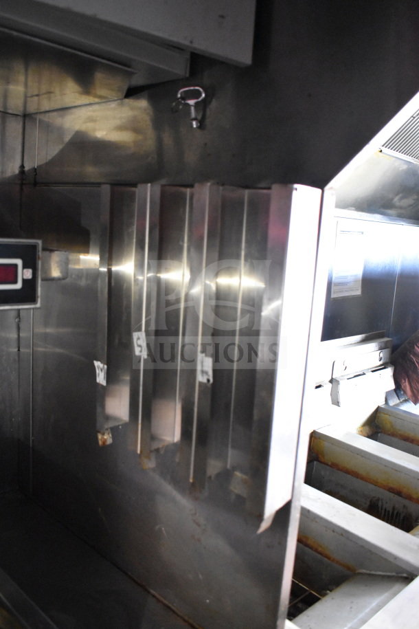 Titanium Cargo Trailers 8.5'x28' food trailer interior, featuring a CaptiveAire grease hood with stainless steel finish.
