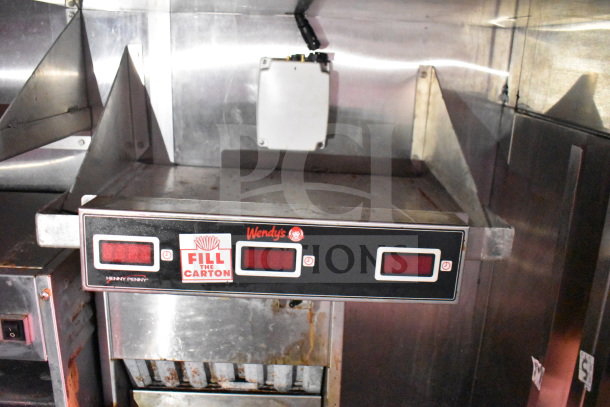 Titanium Cargo Trailers 8.5'x28' food trailer featuring Wendy's branding, Henny Penny fryer, and "Fill the Carton" display.