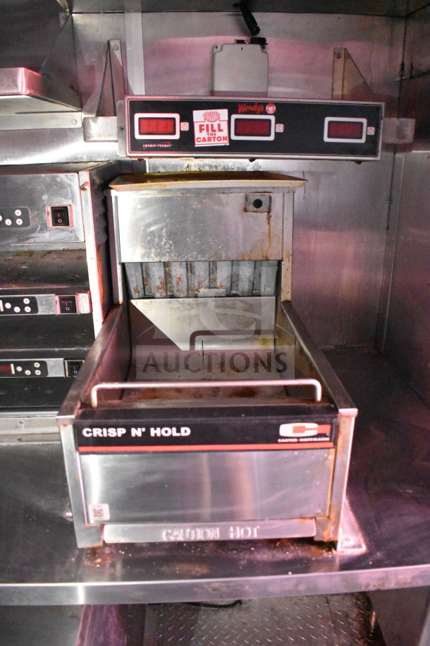 Titanium Cargo Trailers 8.5'x28' food trailer interior with Henny Penny fryer, Crisp N' Hold station, and visible Wendy's branding.