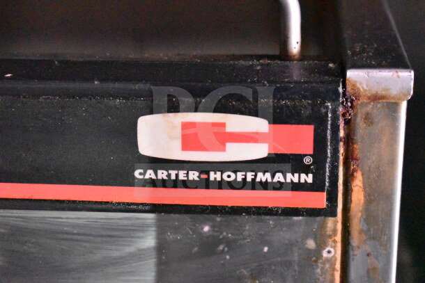 Titanium Cargo Trailers 8.5'x28' Wendy's food trailer detail with Carter-Hoffmann logo, showing slight wear.