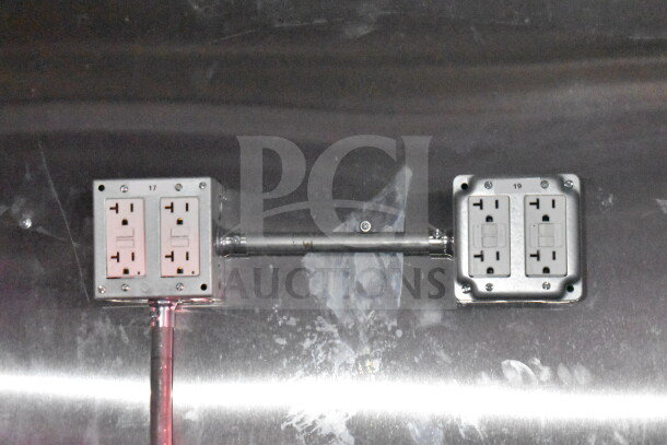 Electrical outlets installed on the polished metal interior of a Titanium Cargo Trailers 8.5'x28' Wendy's Food Trailer.