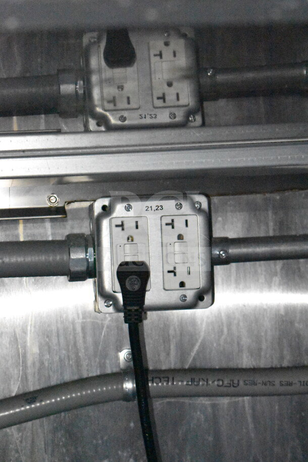 Power outlets with a plug connected inside the Titanium Cargo Trailers 8.5'x28' Wendy's Food Trailer.