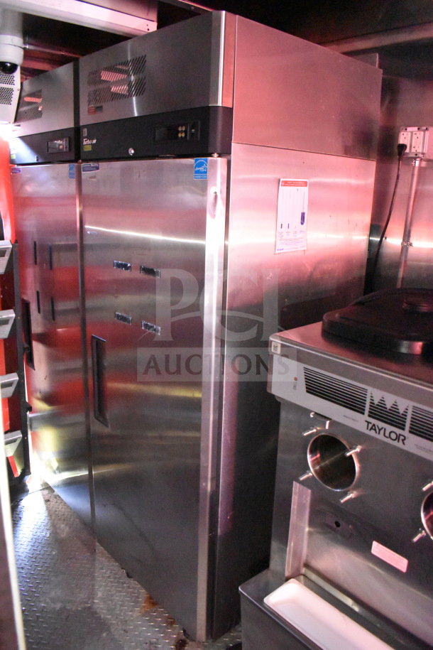 Titanium Cargo Trailers 8.5'x28' food trailer with refrigeration and Taylor shake machine visible inside.