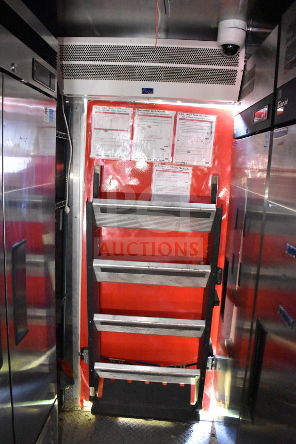 Titanium Cargo Trailers 8.5'x28' food trailer interior with shelving, CaptiveAire hood, and refrigeration units.
