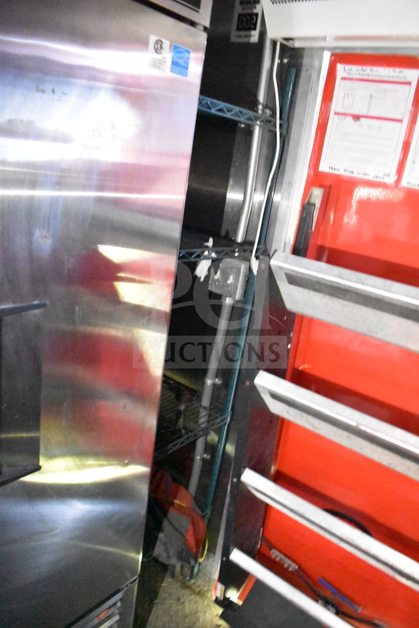 Titanium Cargo Trailers 8.5'x28' food trailer interior with stainless steel surfaces, shelving, and equipment. VIN: 7PLBC2831NM000936.