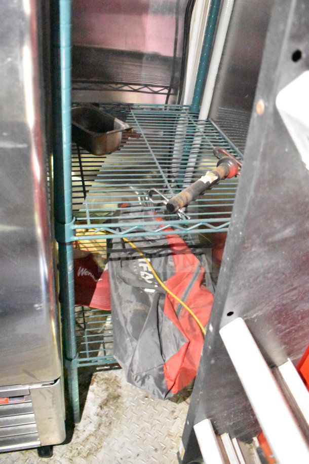 Titanium Cargo Trailers 8.5'x28' food trailer interior, featuring shelving and storage, part of Wendy's equipment setup.