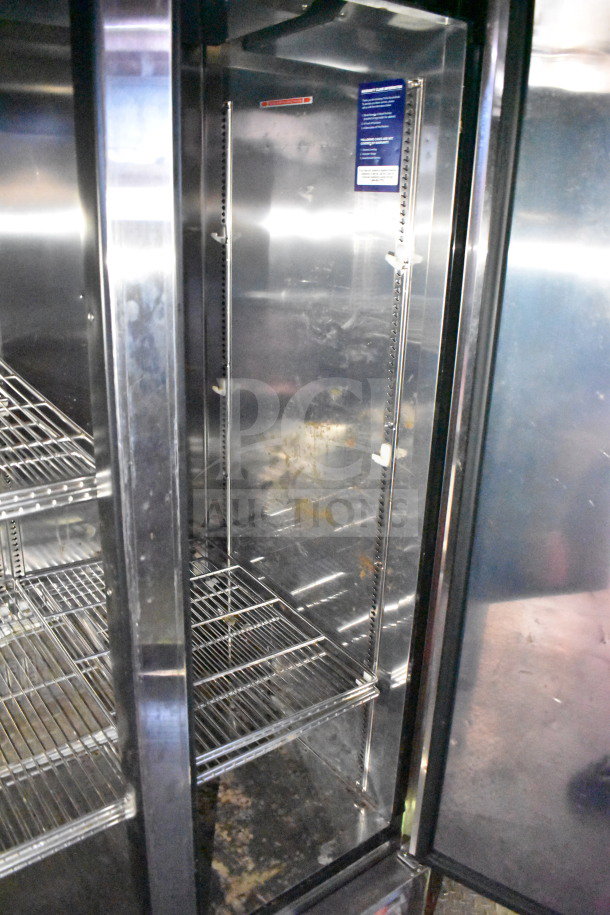Interior view of refrigeration unit inside Titanium Cargo Trailers 8.5'x28' Wendy's food trailer; wire shelves visible.