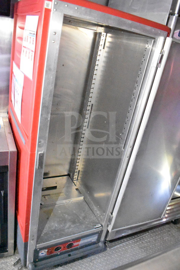 Titanium Cargo Trailer internal view with CaptiveAire grease hood, Taylor shake machine, Henny Penny fryer, and refrigeration.