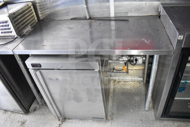 Titanium Cargo Trailers 8.5'x28' food trailer interior with stainless steel countertop and Hoshizaki refrigeration unit.
