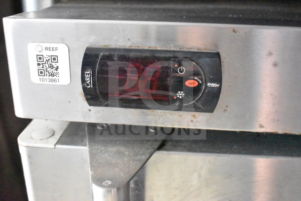 Carel temperature control panel from Titanium Cargo Trailers food trailer. Shows settings interface and QR code with ID 1013861.