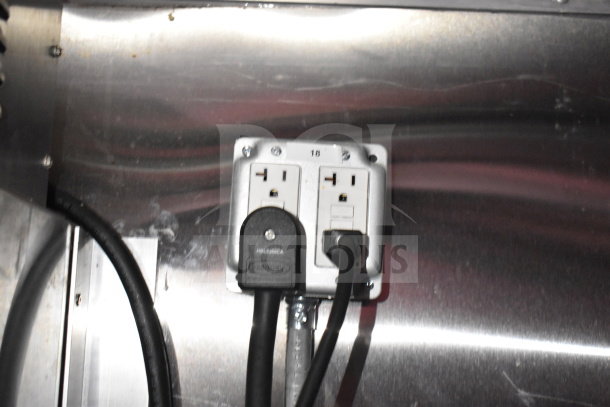 Titanium Cargo Trailers 8.5'x28' Wendy's food trailer interior showing electrical outlet and stainless steel wall finish.