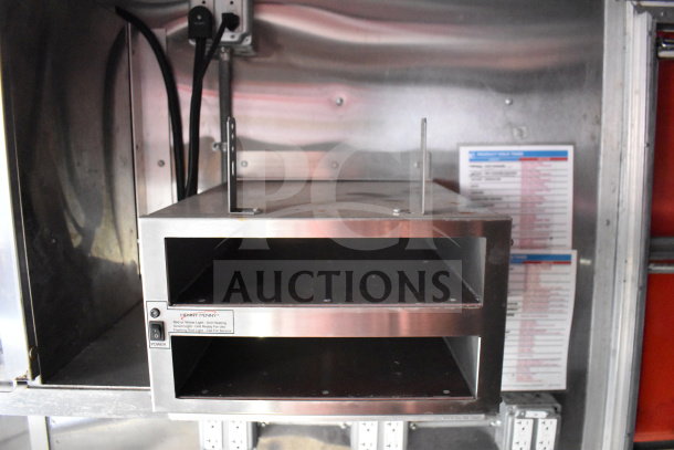 Titanium Cargo Trailers 8.5'x28' Wendy's Food Trailer interior showing Henny Penny heat holding unit with control switch.