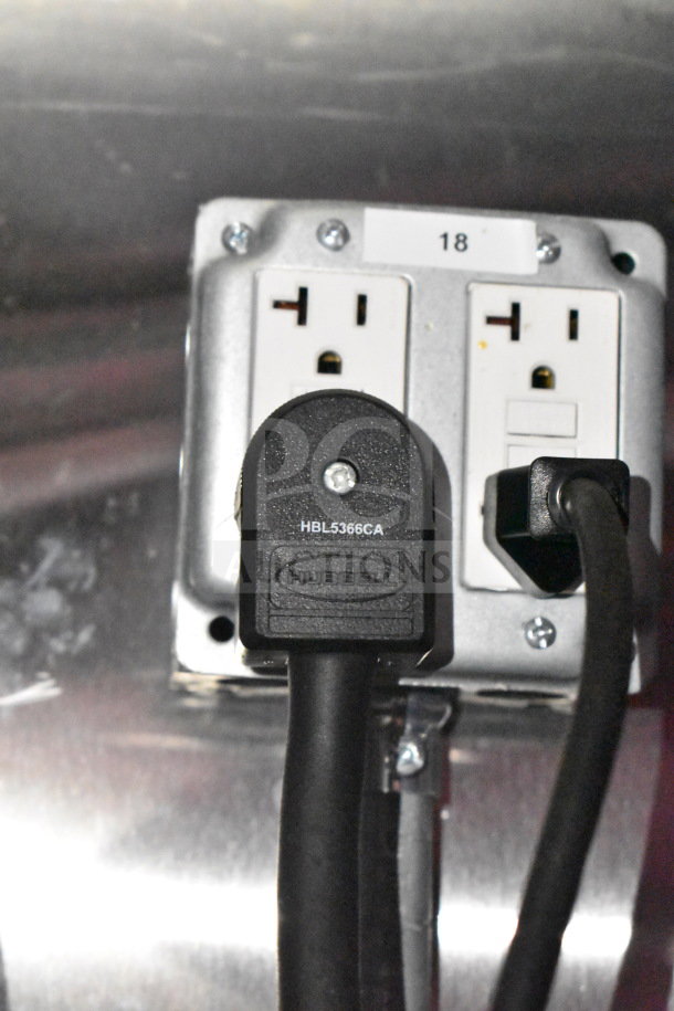 Electrical outlet with Hubbell HBL5366CA plug connected inside 2021 Titanium Cargo Trailers 8.5'x28' Wendy's Food Trailer.