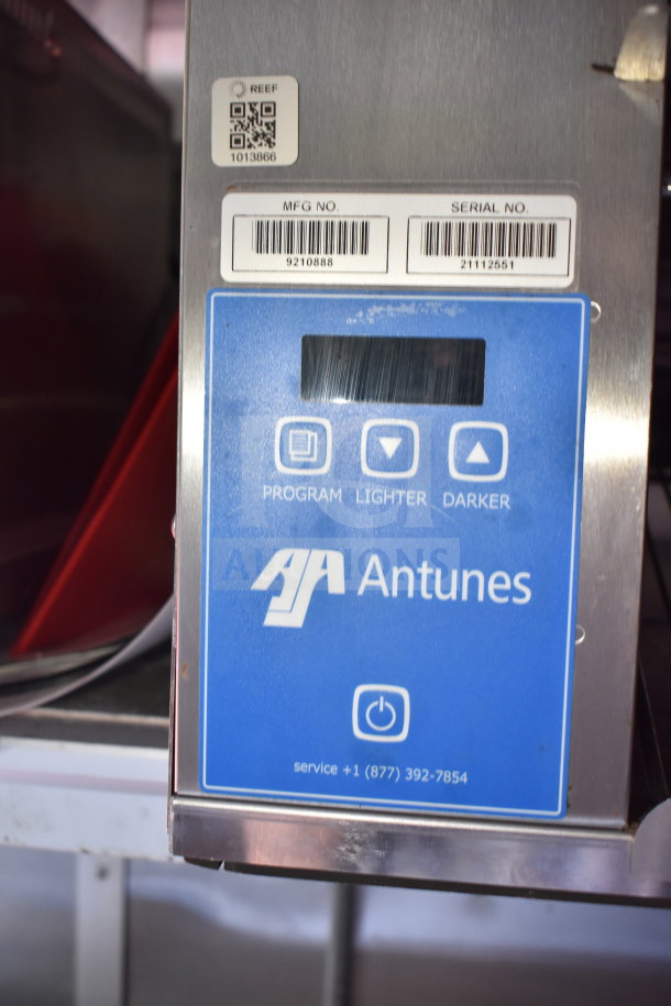 2021 Titanium Cargo Trailer with Antunes control panel, QR code, and serial number label. Features cooking equipment.