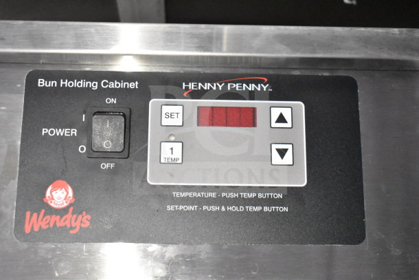 Henny Penny bun holding cabinet panel in a 2021 Titanium Cargo Trailer, featuring Wendy's branding and temperature controls.