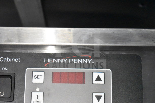Henny Penny fryer control panel, featuring digital display and control buttons, within a 2021 Titanium Cargo Trailers food trailer.