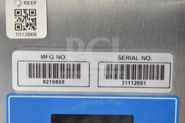 Barcode labels showing manufacturing and serial numbers for equipment in a 2021 Titanium Cargo Trailers food trailer.