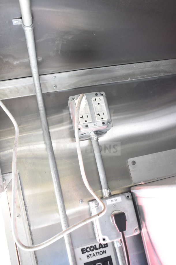 2021 Titanium Cargo Trailer interior, showing electrical outlets and conduits. Ecolab station label visible.