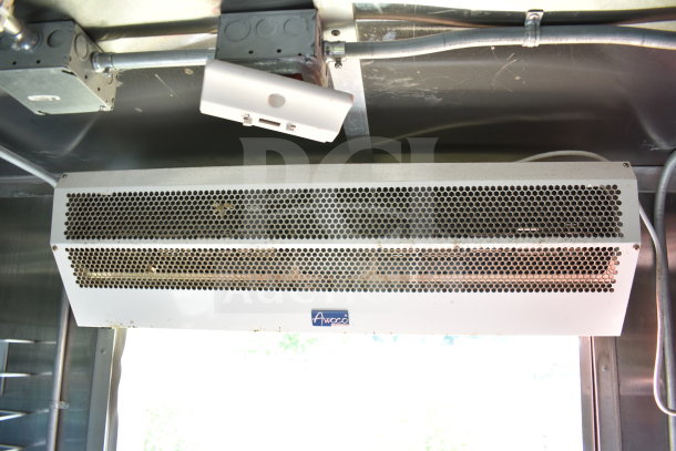 Awoco air curtain installed in 2021 Titanium Cargo Trailers Wendy's Food Trailer. Visible wiring and mounting brackets.