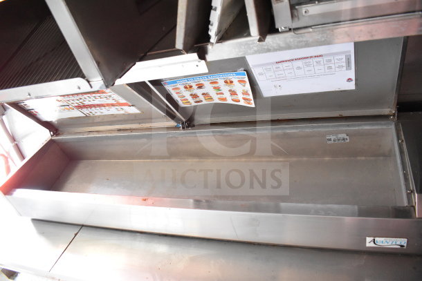 2021 Titanium Cargo 8.5'x28' Wendy's food trailer interior, featuring CaptiveAire grease hood, menu displays, and AvantiCo refrigeration.