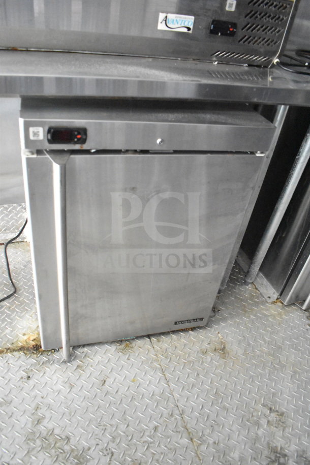 Hoshizaki stainless steel refrigerator inside 2021 Titanium Cargo Trailers 8.5'x28' Wendy's Food Trailer with CaptiveAire hood.
