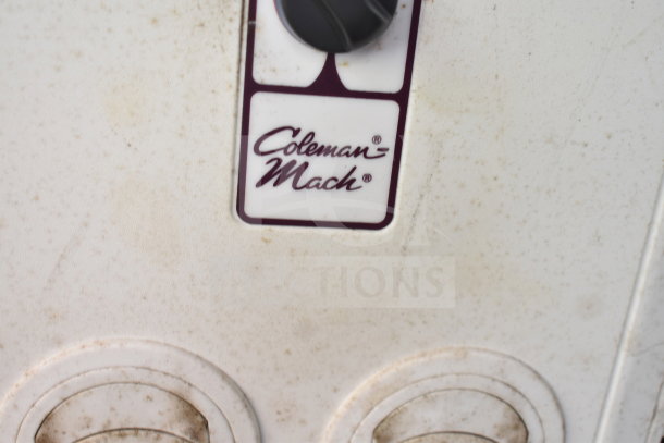 Coleman-Mach air conditioning control panel, showing dial and logo, slightly weathered condition.