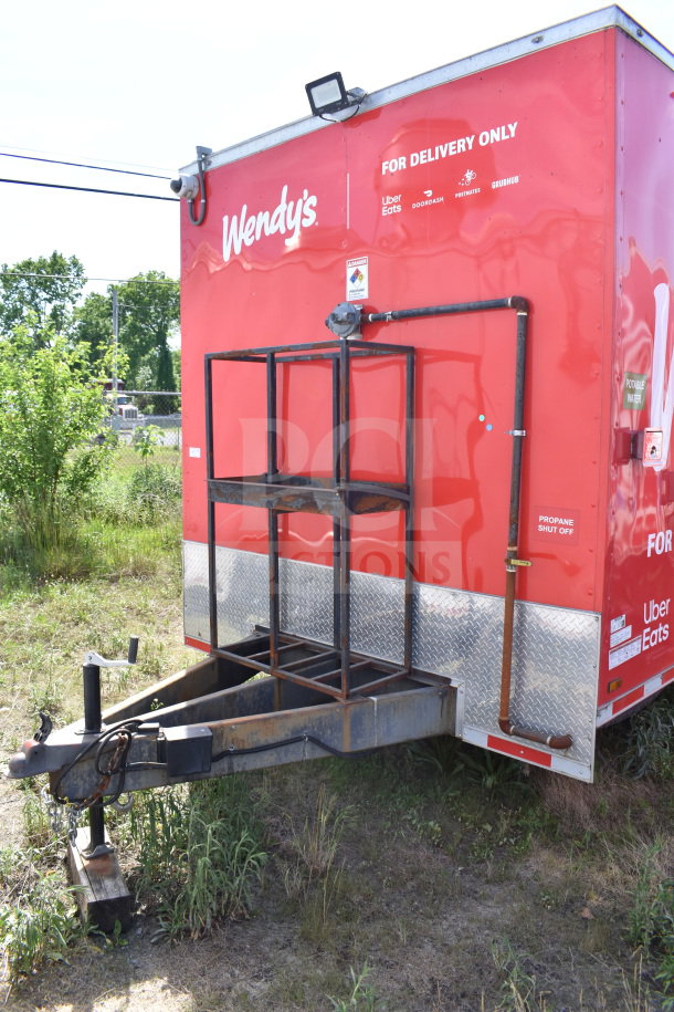 2021 Titanium Cargo Trailers 8.5'x28' Wendy's Food Trailer, red exterior, visible propane shut-off and delivery branding.