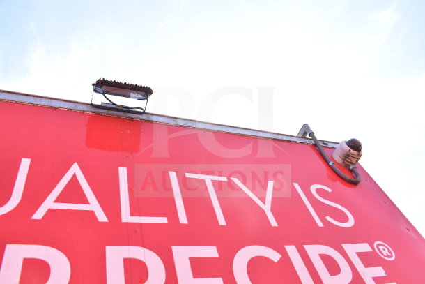 2021 Titanium Cargo 8.5'x28' Wendy's food trailer, light and surveillance camera on red exterior.