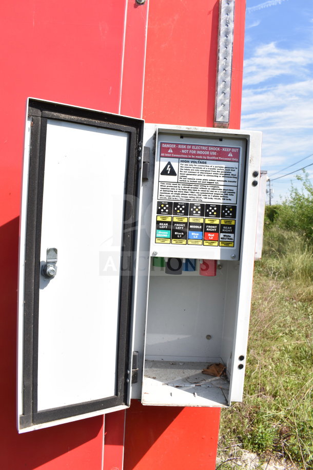Electrical panel on 2021 Titanium Cargo Trailer showing color-coded high voltage labels for wiring connections.