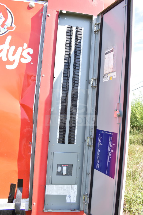 2021 Titanium Cargo Trailers 8.5'x28' Wendy's food trailer, showing open electrical panel with breakers and wiring details.