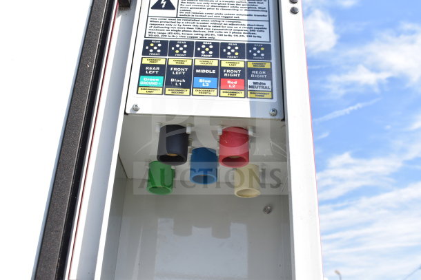 Electrical connection panel on 2021 Titanium Cargo Trailer, featuring labeled color-coded plugs for power distribution.