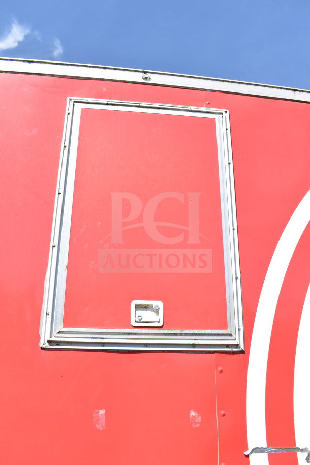 2021 Titanium Cargo Trailers 8.5'x28' food trailer exterior, red with silver trim, features vendor window.