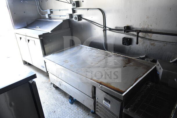 2021 Diamond Cargo 8.5'x24' food trailer interior with CaptiveAire grease hood, Turbochef ovens, refrigeration units.