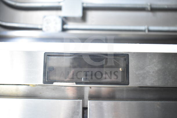 Close-up of control panel inside a 2021 Diamond Cargo food trailer, showing a digital display behind a protective cover.