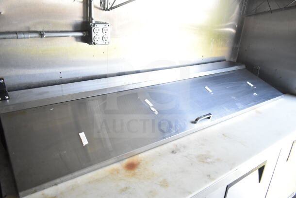 2021 Diamond Cargo food trailer interior showing stainless steel countertop and CaptiveAire grease hood.