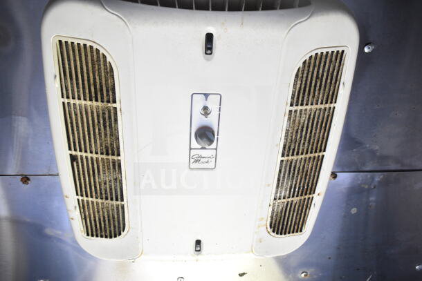 Coleman Mach air conditioning unit mounted inside the Diamond Cargo 8.5'x24' food trailer, visible wear.