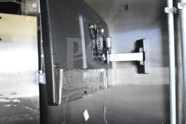 2021 Diamond Cargo 8.5'x24' food trailer interior view, showing mounted grease hood. CaptiveAire system visible.
