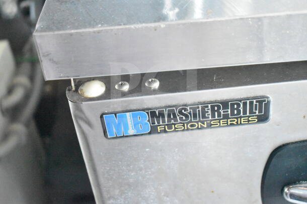 Master-Bilt Fusion Series label on stainless steel appliance, part of 2021 Diamond Cargo food trailer equipment.