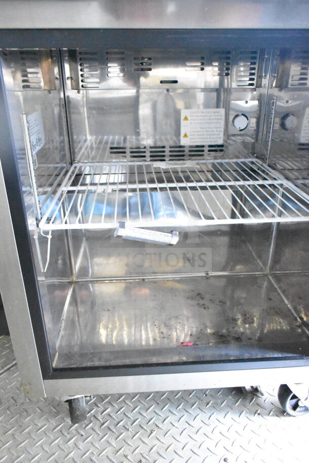 2021 Diamond Cargo 8.5'x24' food trailer interior with CaptiveAire grease hood, Turbochef rapid cook ovens, and refrigeration.