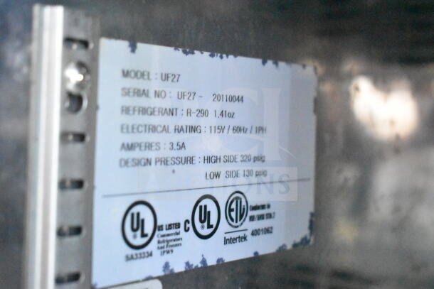 Label on Diamond Cargo 8.5'x24' Food Trailer. Model: UF27, Electrical: 115V/60Hz, Refrigerant: R-290, UL Listed.