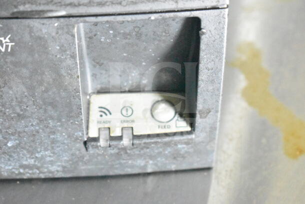 Close-up of a control panel on the 2021 Diamond Cargo food trailer, showing ready, error, and feed indicators.