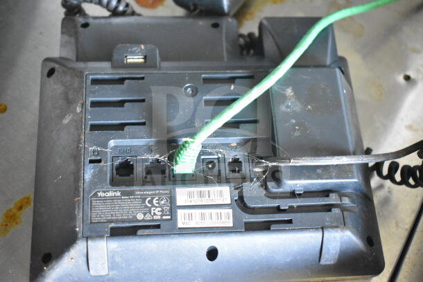 Back of a Yealink IP phone showing ports and connections. Model SIP-T41S visible with CE and FCC labels.