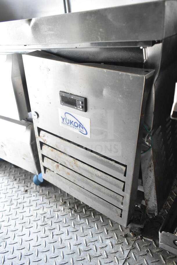2021 Diamond Cargo 8.5'x24' food trailer interior showing Yukon Refrigeration unit. Visible wear and grease marks.