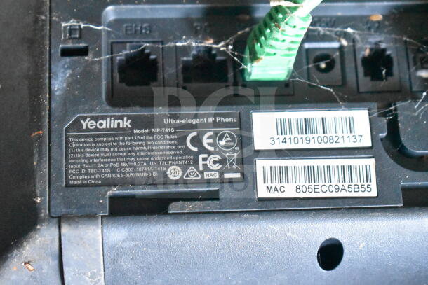 Yealink SIP-T41S Ultra-elegant IP Phone with visible model and FCC compliance tags, ports, and connection cables.